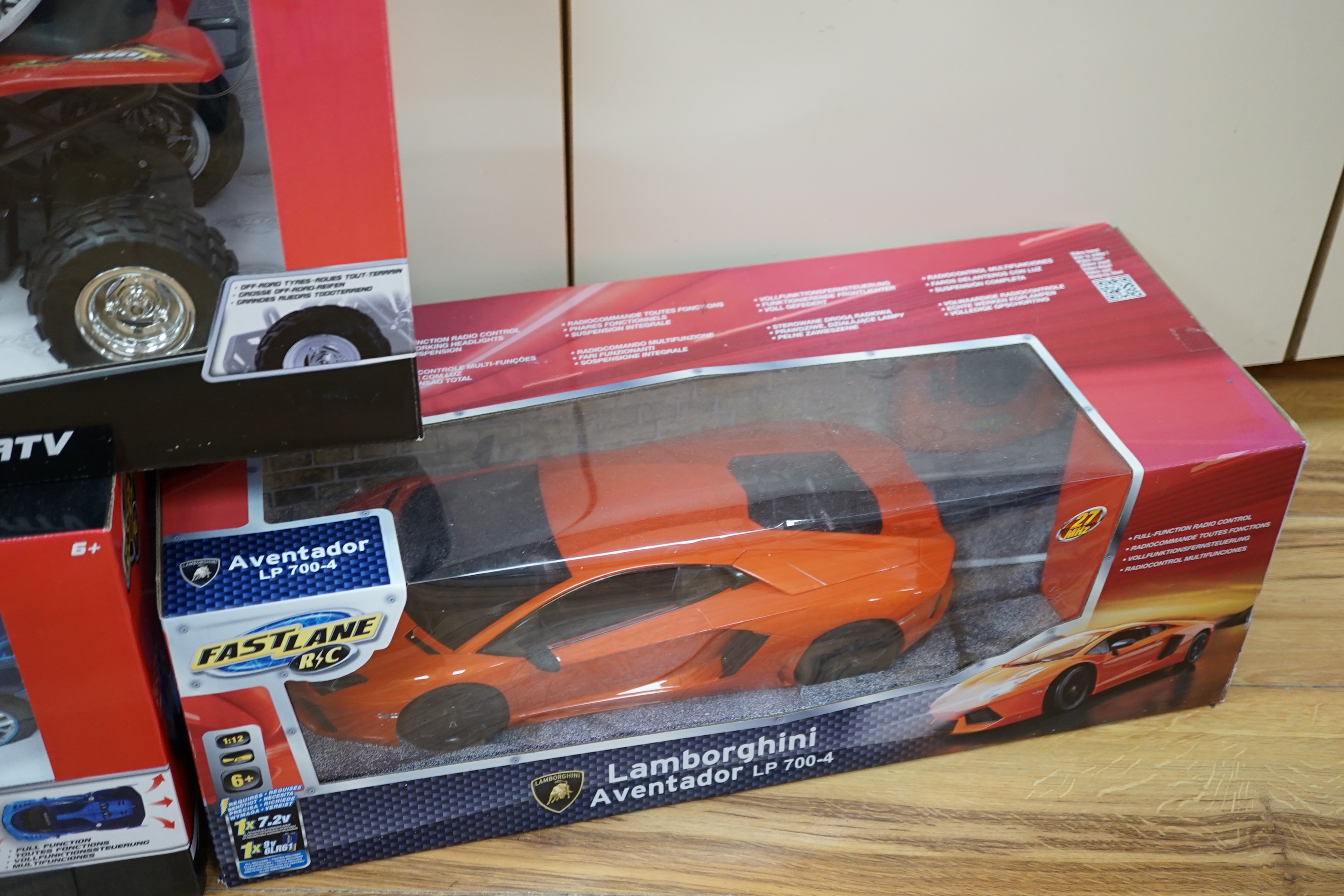 Three boxed FastLane RC cars